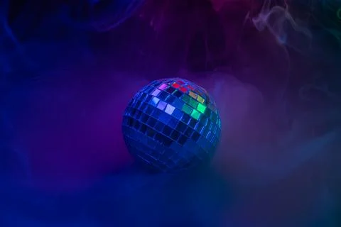 A vibrant, dynamic image showcasing a disco ball with colorful bokeh effect.. Stock Photos