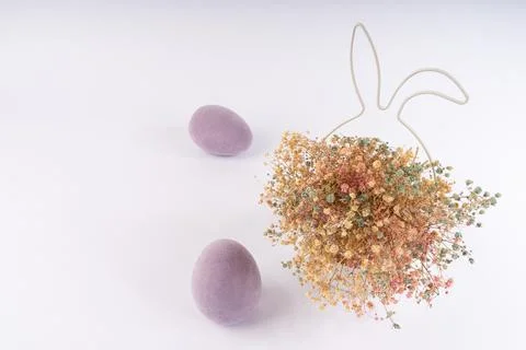 Vibrant Easter Composition with Flocked Purple Eggs and Colorful Dried Flow.. Stock Photos