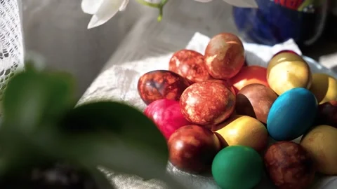 Vibrant Easter Eggs in Sunlit Indoor Setting Stock Footage 333285466