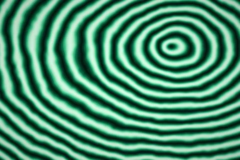 Vibrant emerald green ripple pattern features concentric wavy lines for a h.. Stock Illustration