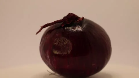 Vibrant exploration of red onions showcasing their beauty and texture in a creat Stock Footage 328634515
