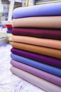 Vibrant Fabric Stack: Colorful Textiles, Wholesale Cloth, Fashion Material Stock Photos