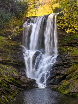 Vibrant fall landscape at Dry Falls. Cascading water drops from rugged rock.. Stock Photos