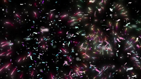 Vibrant fireworks display exploding over a dark night sky with falling confetti 스톡 동영상 338389508