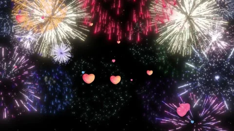 Vibrant fireworks explode with colorful hearts in night sky Stock Footage 337602418