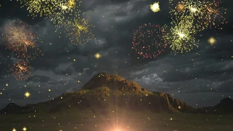 Vibrant fireworks explode over mountain range at night Stock Footage 337524042