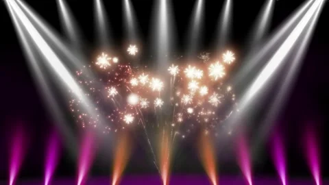Vibrant fireworks explode under colorful stage lights Video stock 336591349