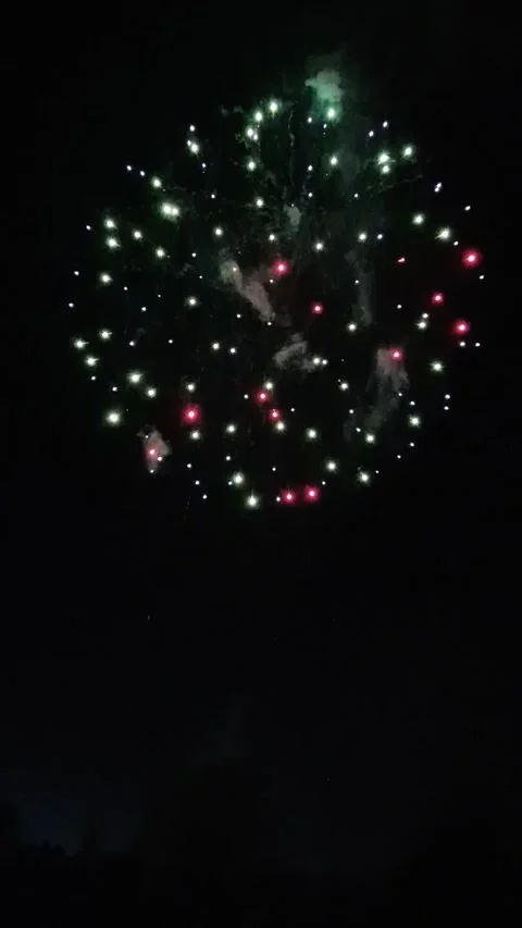 Vibrant Fireworks Exploding in Night Sky during Christmas Lights Switch-On .. Video stock 321655716