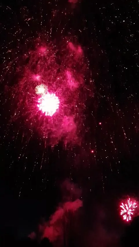 Vibrant Fireworks Exploding in Night Sky during Christmas Lights Switch-On .. Video stock 321655724