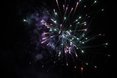 Vibrant Fireworks Exploding in Night Sky, Colorful Sparks Burst Light Up Da.. Stock Photos