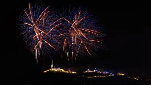 Vibrant Fireworks Exploding Over Historic Hilltop Pagodas In Thailand Night.. Stock Photos