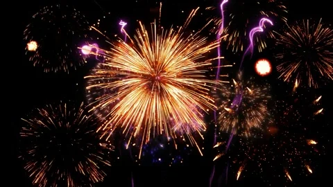 Vibrant fireworks explosion in night sky with colorful glowing spark trails and 库存影片 342899093