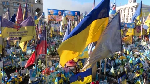 Vibrant flags and banners fill the square in Kyiv, Ukraine, representing Stock Footage 333723145