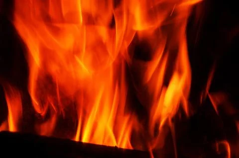 Vibrant flames dancing in the darkness, a captivating display of fire and l.. Stock Photos