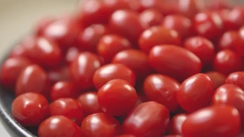 Vibrant, fresh red grape tomatoes grouped together, showcasing texture and color Stock Footage 296323060
