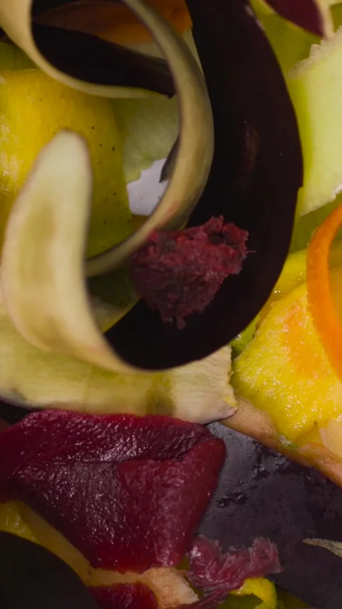 Vibrant fruit and vegetable peels showcase colorful patterns in a creative Stock Footage 320302544