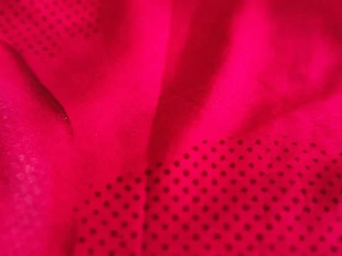 Vibrant fuchsia fabric texture with subtle perforated dots Stock Photos