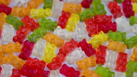 Vibrant gelatin sweets backdrop. Bright gummy bear assortment for packaging. Viv Stock Footage 331680262