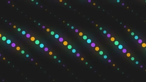 Vibrant glowing colorful circular dots arranged in dynamic wavy patterns across Stock Footage 345315613