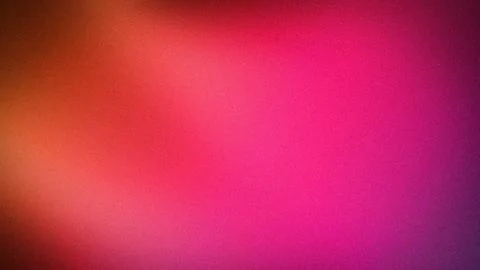 Vibrant grainy gradient background with warm red orange and purple hues for.. Stock Photos
