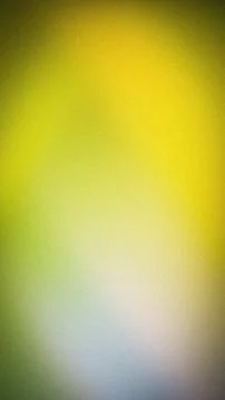 Vibrant grainy gradient background in yellow, lime green, white, and soft b.. Stock Photos