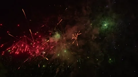 Vibrant green and red fireworks display Stock Footage 346644627