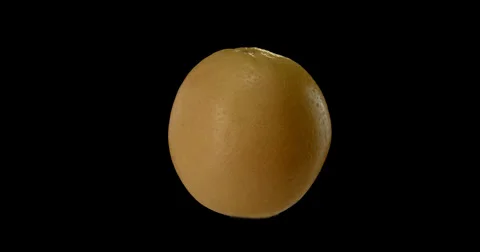 A vibrant green apple gracefully orbits against a dark. Stock Footage 300498884