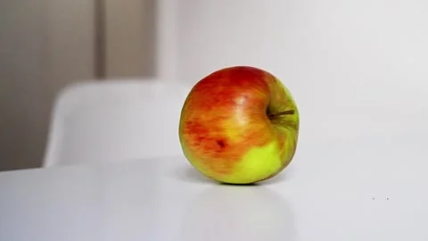 A vibrant green apple is shown whole and sliced, highlighting its vivid colors Stock Footage 310465962