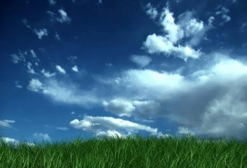 Vibrant green grass field under a dramatic deep blue sky filled with fluffy.. 写真素材