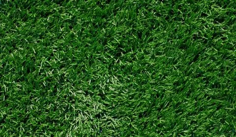 Vibrant green grass texture background Stock Photos