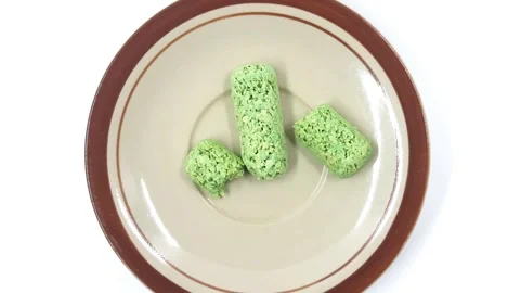 Vibrant green textured snacks on a rustic plate, top view footage 库存影片 332711331