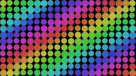 A vibrant grid of multicolored circular dots creating a rainbow effect Video stock 335117671