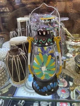 Vibrant Hand-Painted Lantern and Traditional Dholak Miniature Stock Photos