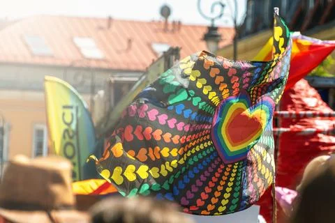 Vibrant heart pattern rainbow flag at outdoor pride celebration Stock Photos