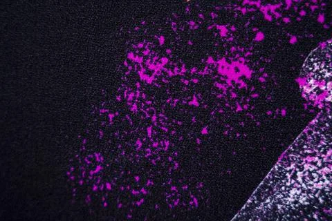 Vibrant Holi Colors Splashed on Black Textured Cloth Stock Photos