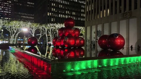 A Vibrant Holiday Display Featuring Bright Red Ornaments Complemented by 스톡 동영상 314245574