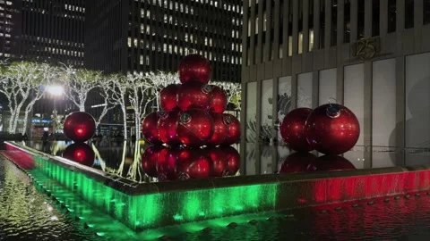 A Vibrant Holiday Display Featuring Bright Red Ornaments Complemented by Stock Footage 314248826