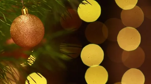 Vibrant Holiday Loop with Golden Bauble and Blinking Lights. Vídeos de archivo 344405264