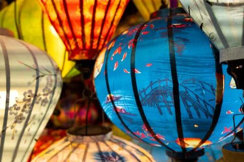 Vibrant, intricately patterned lanterns in assorted shapes and colors hang gr 写真素材