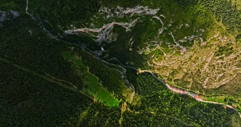 Vibrant Landscape Road Passing Through Mountain Crevice High Altitude Aerial Stock-Footage 300478485