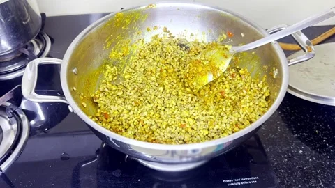 Vibrant Lentil Curry Simmering on Clean Indian Stove top Stock Footage 314178092