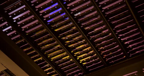 Vibrant Light and Motion Above Metal Ceiling Grid Stock Footage 309706492