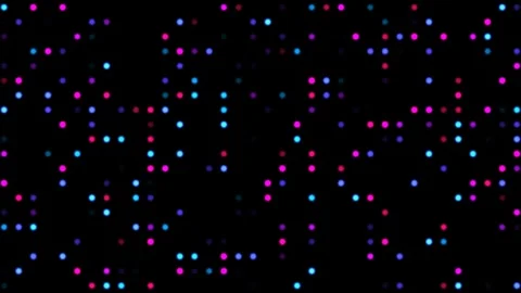 Vibrant light dots create a dynamic effect on a dark Stock Footage 338295037