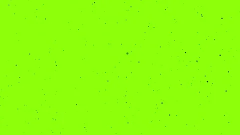 Vibrant lime green screen animation with dynamic black dust particles creating Stock Footage 321386479