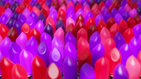 Vibrant lipstick tubes creating dynamic color gradient pattern, showcasing Stock Footage 308003075