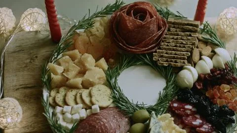 Vibrant macro preparation of adding cheese to the holiday plate Stock Photos