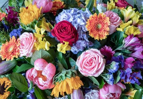 A vibrant mixed bouquet featuring several types of various flowers, includi.. Stock Photos