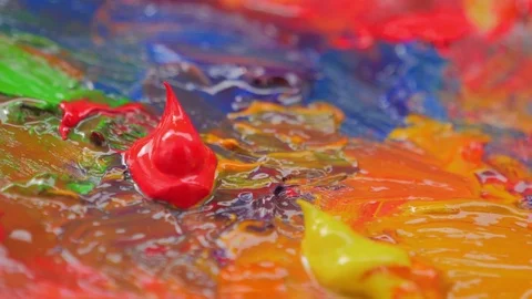 Vibrant multi colored oil paints on a wooden palette Stockbeeldmateriaal 77857162
