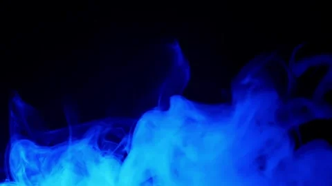 Vibrant Multi Colored Smoke Billowing Against Black Background 库存影片 330116301