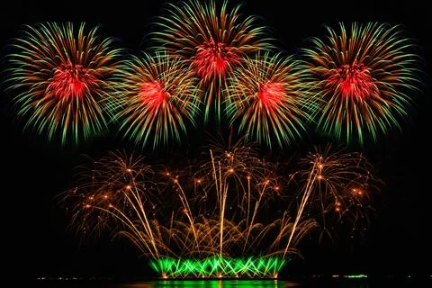 Vibrant Multicolored Fireworks Display Exploding In Night Sky Wide Shot Stock Photos